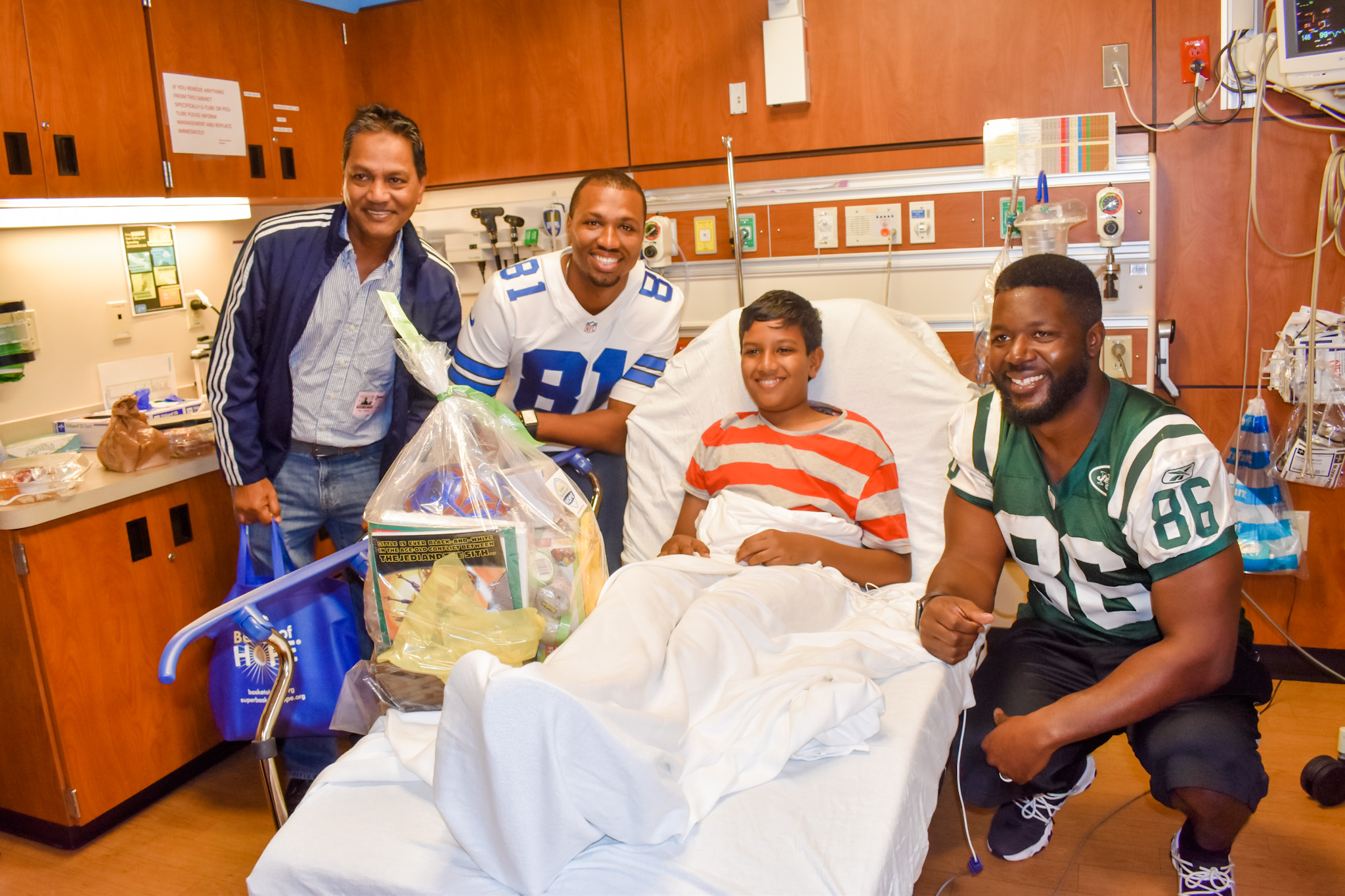 Former NFL Players, Super Bowl Cheerleaders Assemble 'Baskets of Hope' for Sick Children 1