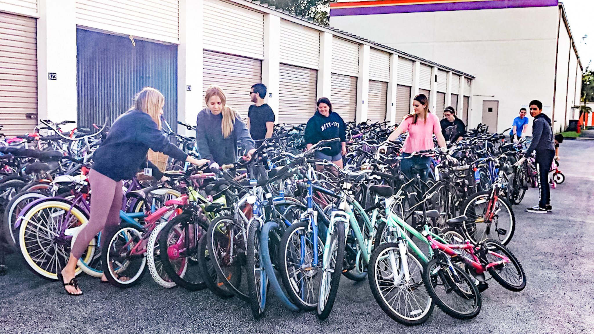 Marjory Stoneman Douglas High School DECA chapter members with donated bikes; courtesy photo {Lexie Sealy}