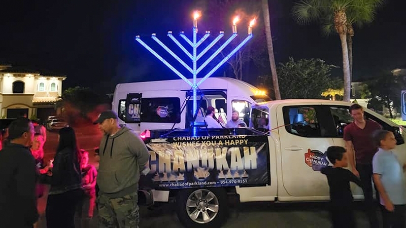 Chabad of Parkland's Traveling Chanukah Experience Turns Holiday Fun Mobile